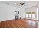 Spacious living room with fireplace, wood-look flooring, and ample natural light at 112 Mayfield Dr, Goose Creek, SC 29445