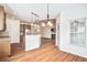 Inviting living space with kitchen featuring pendant lights, open to a bright living area at 112 Mayfield Dr, Goose Creek, SC 29445
