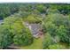 Aerial view of estate home with mature landscaping and backyard patio at 115 Old Postern Rd, Summerville, SC 29483