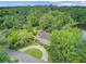 Aerial view of estate home with mature landscaping and circular driveway at 115 Old Postern Rd, Summerville, SC 29483