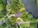 Aerial view of estate home with mature landscaping and waterfront access at 115 Old Postern Rd, Summerville, SC 29483