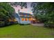 A beautiful back exterior home with brick trim and a lush green lawn, perfect for families and entertaining outdoors at 115 Old Postern Rd, Summerville, SC 29483