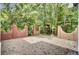 Paver patio with brick columns, trees, and landscaping creates a private and appealing outdoor space perfect for entertaining at 115 Old Postern Rd, Summerville, SC 29483