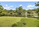 Picturesque waterfront property with lush green lawn and serene lake views at 115 Old Postern Rd, Summerville, SC 29483