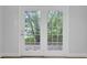 View to the back yard with lush trees at 115 Old Postern Rd, Summerville, SC 29483