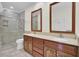 Bathroom features a double vanity, granite countertops and tiled glass enclosed shower at 115 Old Postern Rd, Summerville, SC 29483