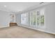 Light filled bonus room with carpet and large windows at 115 Old Postern Rd, Summerville, SC 29483