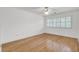 This bedroom features hardwood floors, neutral walls, shuttered windows, and a ceiling fan at 115 Old Postern Rd, Summerville, SC 29483