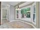 Charming breakfast nook with large windows offering scenic backyard views and a decorative chandelier at 115 Old Postern Rd, Summerville, SC 29483