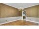 Another angle on elegant dining room featuring hardwood floors and stylish chandelier at 115 Old Postern Rd, Summerville, SC 29483