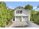 Charming white brick home with a two-car garage and well-maintained landscaping at 115 Old Postern Rd, Summerville, SC 29483