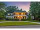 Elegant two-story home featuring a welcoming porch and beautifully landscaped front yard at 115 Old Postern Rd, Summerville, SC 29483