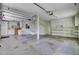 Spacious two-car garage with ample storage space and built-in shelving at 115 Old Postern Rd, Summerville, SC 29483