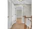 Bright hallway featuring hardwood floors and white doors leading to other rooms at 115 Old Postern Rd, Summerville, SC 29483