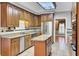 Classic kitchen with ample counter space, stainless steel appliances, granite countertops, and a functional island at 115 Old Postern Rd, Summerville, SC 29483