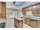 Traditional kitchen featuring wood cabinets, granite countertops, stainless steel appliances and a functional island at 115 Old Postern Rd, Summerville, SC 29483