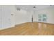 Open living room showcasing hardwood floors and access to the patio through French doors at 115 Old Postern Rd, Summerville, SC 29483