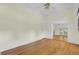 Spacious living room featuring gleaming hardwood floors and neutral paint palette at 115 Old Postern Rd, Summerville, SC 29483