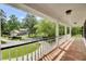 Inviting porch view featuring a home with beautifully landscaped grounds at 115 Old Postern Rd, Summerville, SC 29483