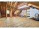 Unfinished attic with wooden beams and open space for potential expansion at 115 Old Postern Rd, Summerville, SC 29483