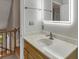 Upstairs bathroom showcasing a marble countertop, sleek sink, and a modern, lighted mirror above the vanity at 1199 Parkway Drive, Mount Pleasant, SC 29464