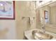Stylish powder room with a metallic sink, modern faucet, and decor at 1199 Parkway Drive, Mount Pleasant, SC 29464