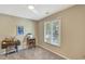 Bedroom with neutral walls featuring a desk, sewing machine, and natural light through a window at 1199 Parkway Drive, Mount Pleasant, SC 29464