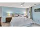 Cozy bedroom with soft blue walls, ceiling fan, and bedside tables with lamps at 1199 Parkway Drive, Mount Pleasant, SC 29464