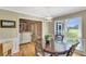 Dining area open to living room with wood floors, decor, and natural light at 1199 Parkway Drive, Mount Pleasant, SC 29464