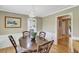 Charming dining room featuring a wood table, wainscoting, and stylish light fixture at 1199 Parkway Drive, Mount Pleasant, SC 29464