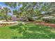 Charming home featuring lush green lawn, mature trees, and an inviting curb appeal at 1199 Parkway Drive, Mount Pleasant, SC 29464