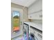 Functional laundry room with washer, dryer, counter space, and exterior access at 1199 Parkway Drive, Mount Pleasant, SC 29464