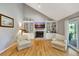 Inviting living room featuring a fireplace, built-in shelving and hardwood floors at 1199 Parkway Drive, Mount Pleasant, SC 29464
