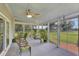 Bright sunroom with views of the expansive backyard, ceiling fan and lots of plants at 1199 Parkway Drive, Mount Pleasant, SC 29464