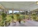 Sunroom featuring large windows offering beautiful backyard views and lots of plants at 1199 Parkway Drive, Mount Pleasant, SC 29464