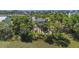 Aerial view of a coastal home nestled amongst lush greenery, offering privacy and scenic views at 123 Jungle Rd, Edisto Island, SC 29438