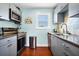 Updated kitchen offers granite countertops, stainless steel appliances, and ample storage at 123 Jungle Rd, Edisto Island, SC 29438