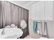 Bathroom featuring a sink, toilet, and shower curtain with flower and cabinet for storage at 1237 Fort Dr, Hanahan, SC 29410