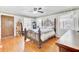 Cozy bedroom with hardwood floors, ceiling fan, and natural light from multiple windows at 1237 Fort Dr, Hanahan, SC 29410