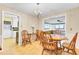 Charming dining room with classic table, chairs and chandelier, flowing into the living room at 1237 Fort Dr, Hanahan, SC 29410