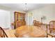 Dining room featuring a wooden table set, china cabinet and view of the adjacent kitchen at 1237 Fort Dr, Hanahan, SC 29410