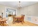Cozy dining room featuring classic wood furniture, complemented by elegant wallpaper and a chandelier at 1237 Fort Dr, Hanahan, SC 29410