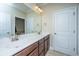 Bathroom featuring a double sink vanity with white marble countertop, and updated fixtures at 1253 Dingle Rd, Mount Pleasant, SC 29466