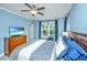 Charming bedroom featuring wood furniture, soft carpet, large windows, and comfortable bedding at 1253 Dingle Rd, Mount Pleasant, SC 29466