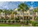 Attractive townhomes with lush landscaping, palm trees, private garages, and inviting curb appeal at 1253 Dingle Rd, Mount Pleasant, SC 29466