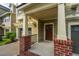 Inviting front porch with brick accents, a pergola, and a view of the front yard at 1253 Dingle Rd, Mount Pleasant, SC 29466