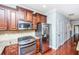 Modern kitchen with stainless steel appliances, granite countertops, and dark wood cabinets at 1253 Dingle Rd, Mount Pleasant, SC 29466