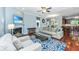 Cozy living room featuring a fireplace, comfortable seating, and views into the dining area at 1253 Dingle Rd, Mount Pleasant, SC 29466