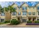 View of exterior townhouses with ample parking, manicured trees, and lovely landscape at 1253 Dingle Rd, Mount Pleasant, SC 29466