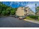 Exterior view of townhouses featuring an abundance of parking and well-maintained landscaping at 1253 Dingle Rd, Mount Pleasant, SC 29466